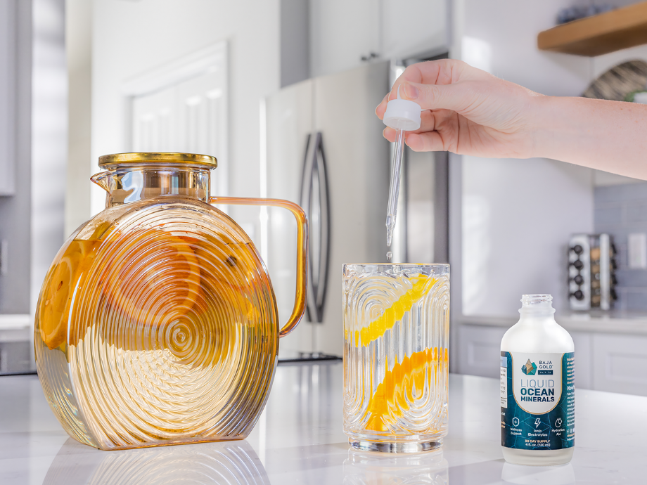 Baja Gold Salt Co.'s Liquid Ocean Minerals dropping into citrus infused water